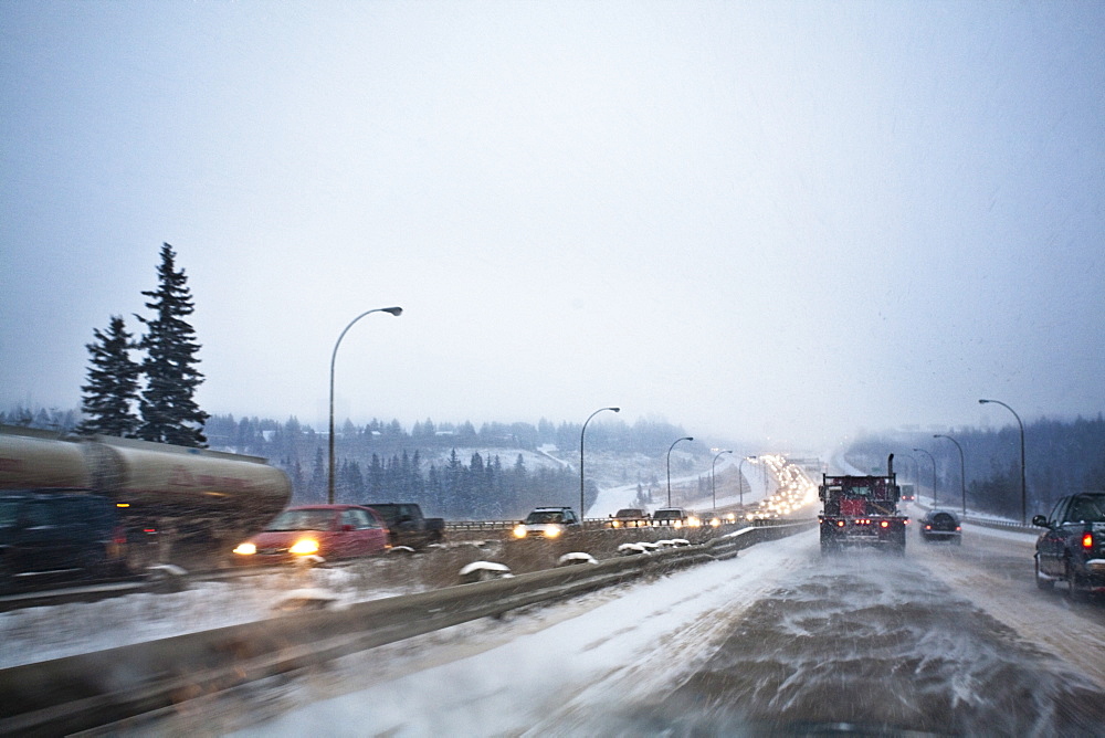 Edmonton, Alberta, Canada, Vehicles Traveling On The Road With Snow Blowing In Winter