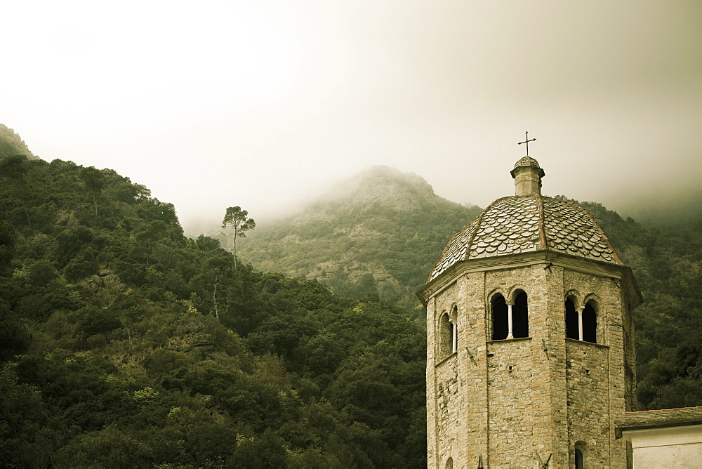 Low Lying Cloud In The Hills And A Cross Atop A Building's Tower, San Frutuozzo, Liguria, Italy