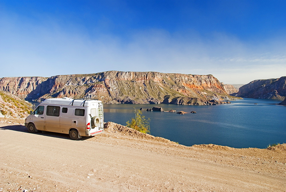 A Camper Van Parked Beside The Lake In Ca?on Del Atuel, San Rafael, Mendoza, Argentina