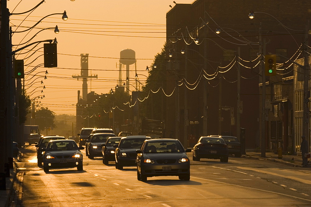 View Of Traffic At Sunrise On Queen Street In Downtown Toronto, Ontario, Canada