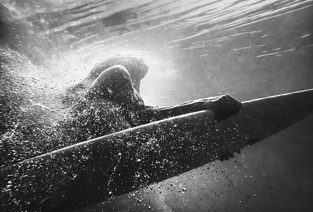 A Woman On A Surfboard Under The Water, Tarifa, Cadiz, Andalusia, Spain