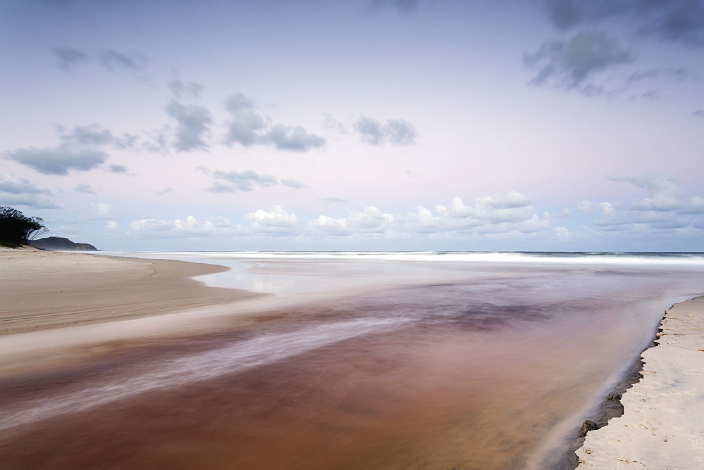 Tallows creek running out into the ocean at a spot known as dolphins at tallows beach after heavy storms, Byron bay new south wales australia