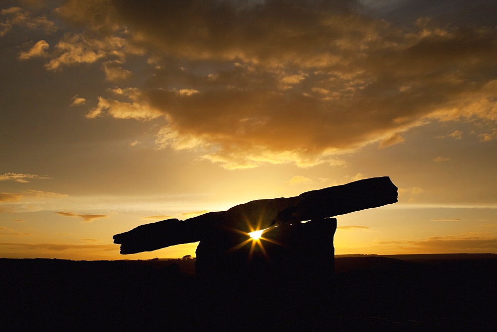 The poulnabrone dolmen at sunset, near ballyvaghan, County clare, ireland