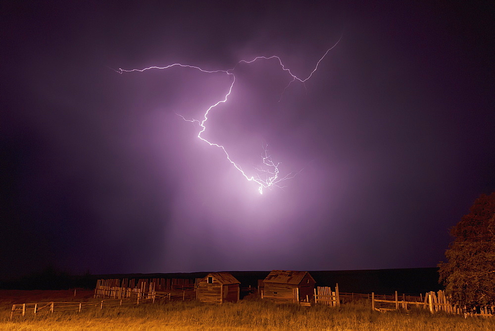 Lightning bolt over some abandoned buildings near val marie, Saskatchewan canada