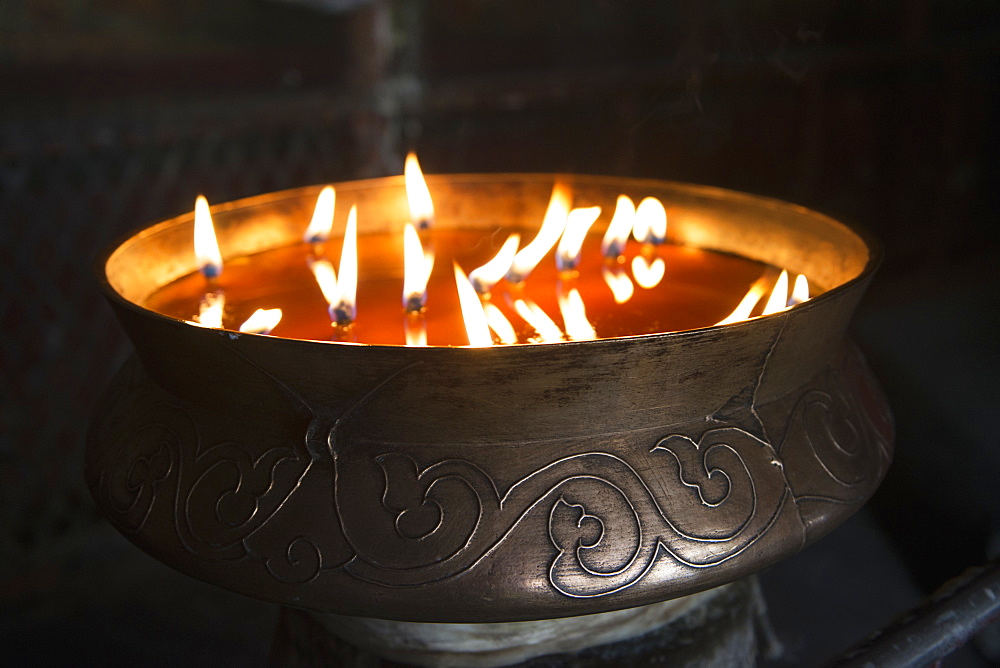 Flames burning in a bronze container at the jokhang temple, Lhasa xizang china