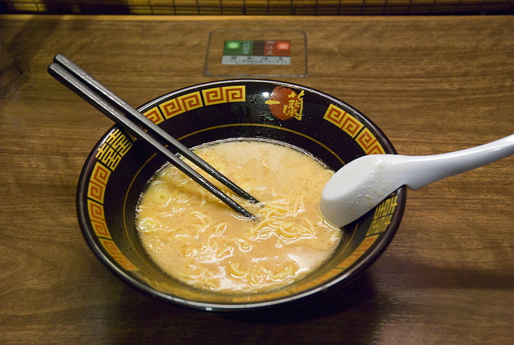 Black bowl of japanese noodles on a wooden table, Kyoto japan