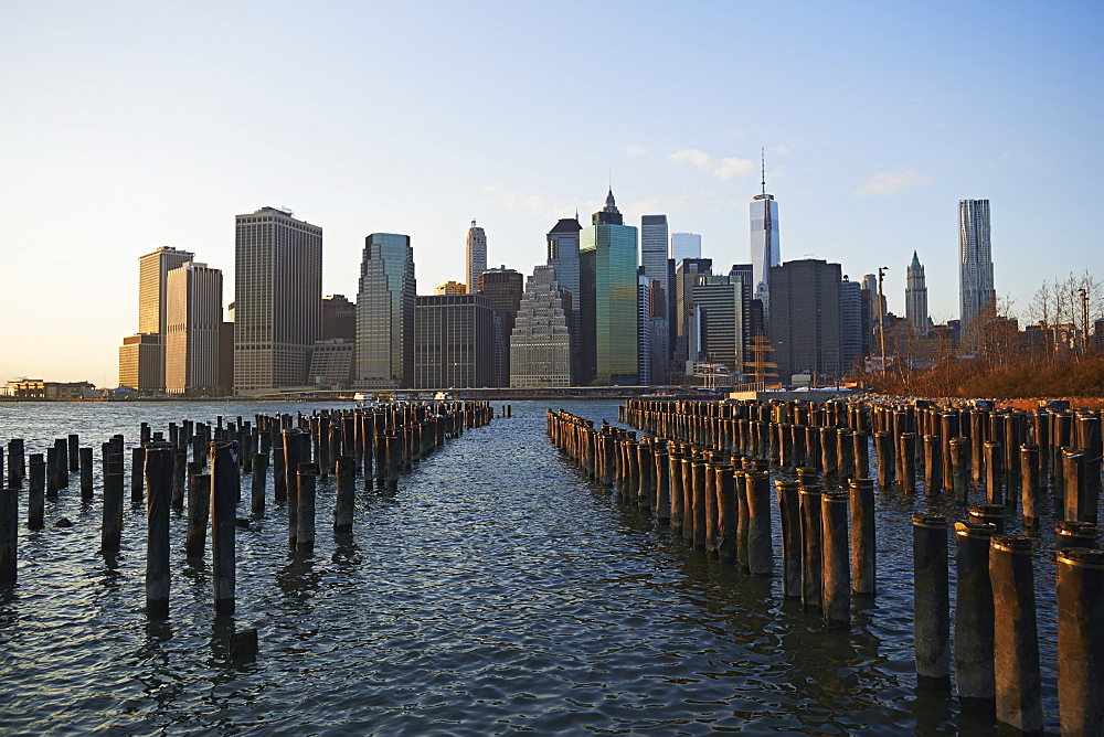 View Of Financial District Of Manhattan From Brooklyn Bridge Park At Sunset, New York City, New York, United States Of America