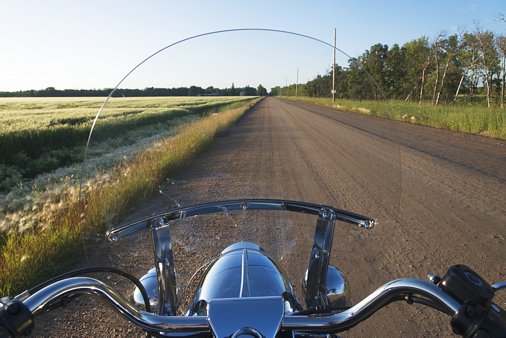 View Of A Dirt Road Through A Motorcycle Windshield, Winnipeg, Manitoba, Canada