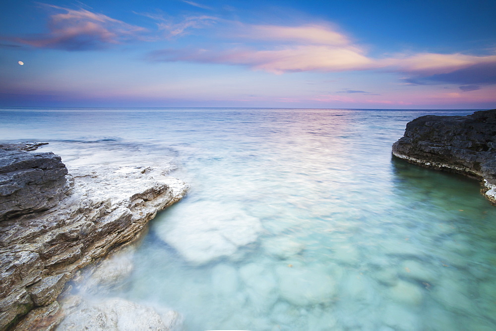 Seeing Into The Clear Rocky Water At Sunset At Cave Point In Sturgeon Bay, Wisconsin, United States Of America