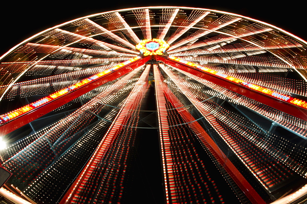 Ferris Wheel Glowing And Spinning At Nighttime, Locarno, Ticino, Switzerland