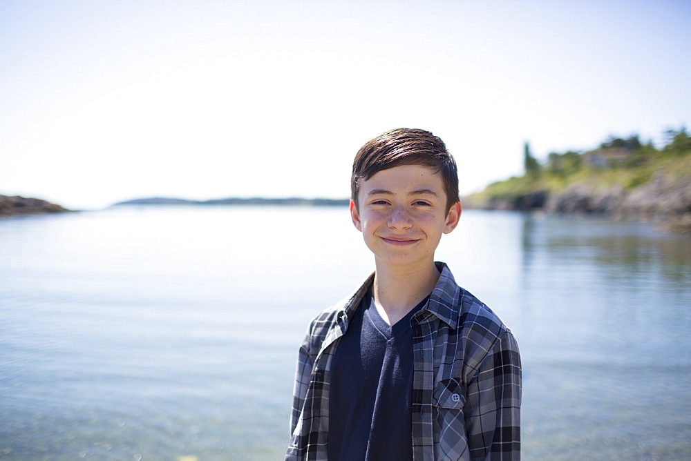 Portrait Of A Boy With The Water And Coastline In The Background, Victoria, British Columbia, Canada