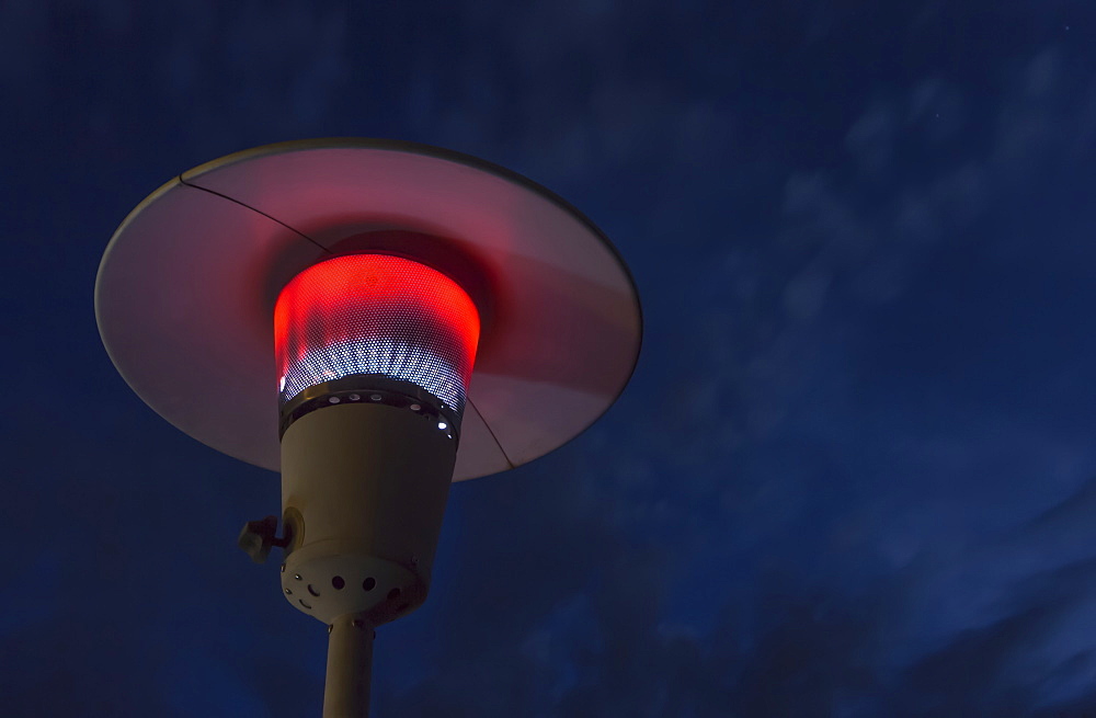 A Propane Torch Lamp Is Lit At Night, Fort Mcmurray, Alberta, Canada