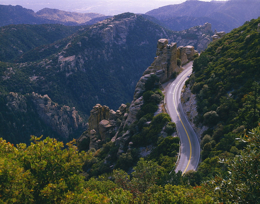 Highway Winds Through A Rugged Landscape