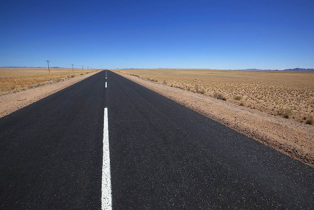 White line on a paved road in the desert, Garub namibia