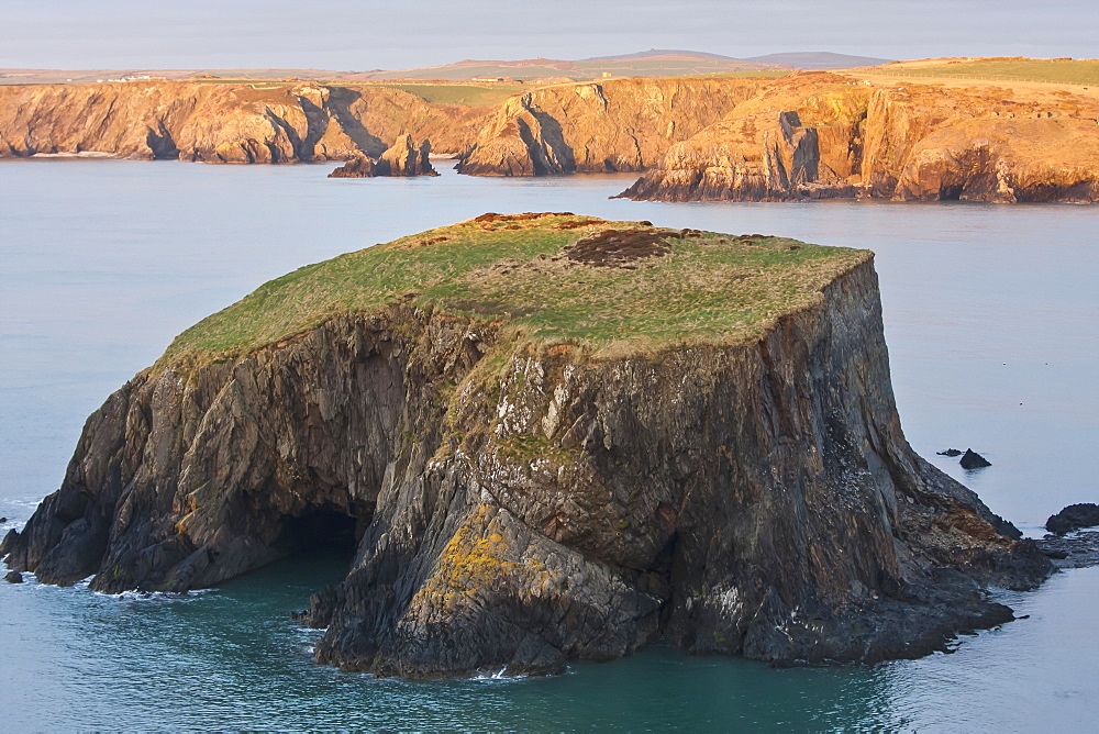 Small Island And Cliffs At Sundown Near Trefin Village On The Pembrokeshire Coast Path, Wales