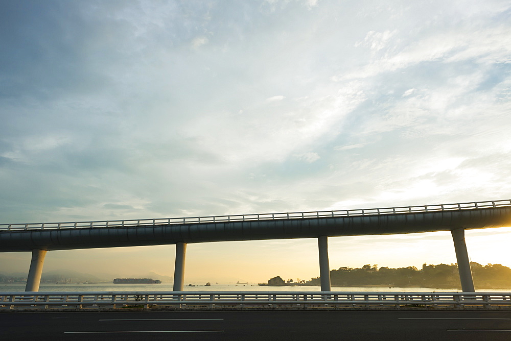 Highway From Xiamen City, China At Sunset, With Gulangyu Island In The Background, Xiamen, China