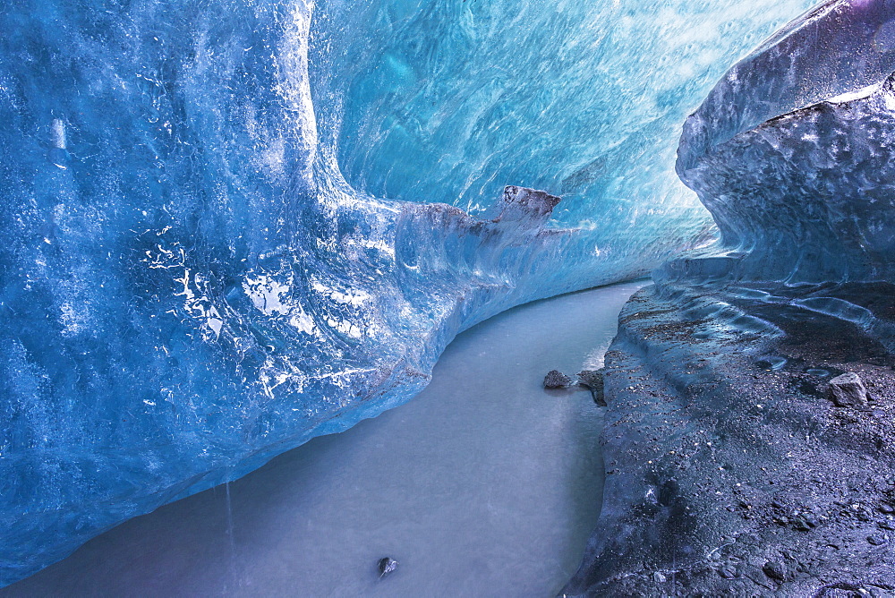 View Of An Ice Tunnel And River Flowing Inside Of The Matunuska Glacier, Alaska, United States Of America