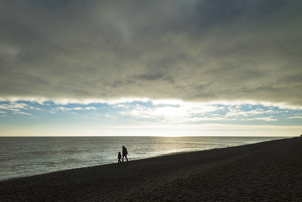 Mother And Daughter Walking Along Beach, Aldeburgh, Suffolk, England