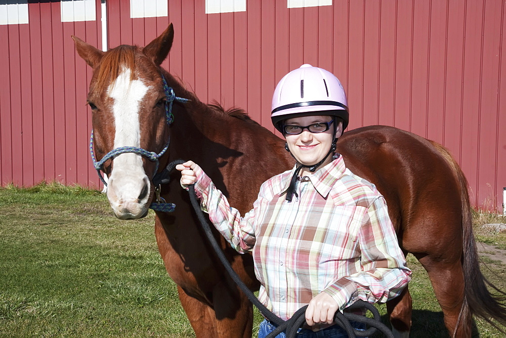 A Young Woman Posing With Her Horse At Eagle Mount, Bozeman, Montana, United States Of America