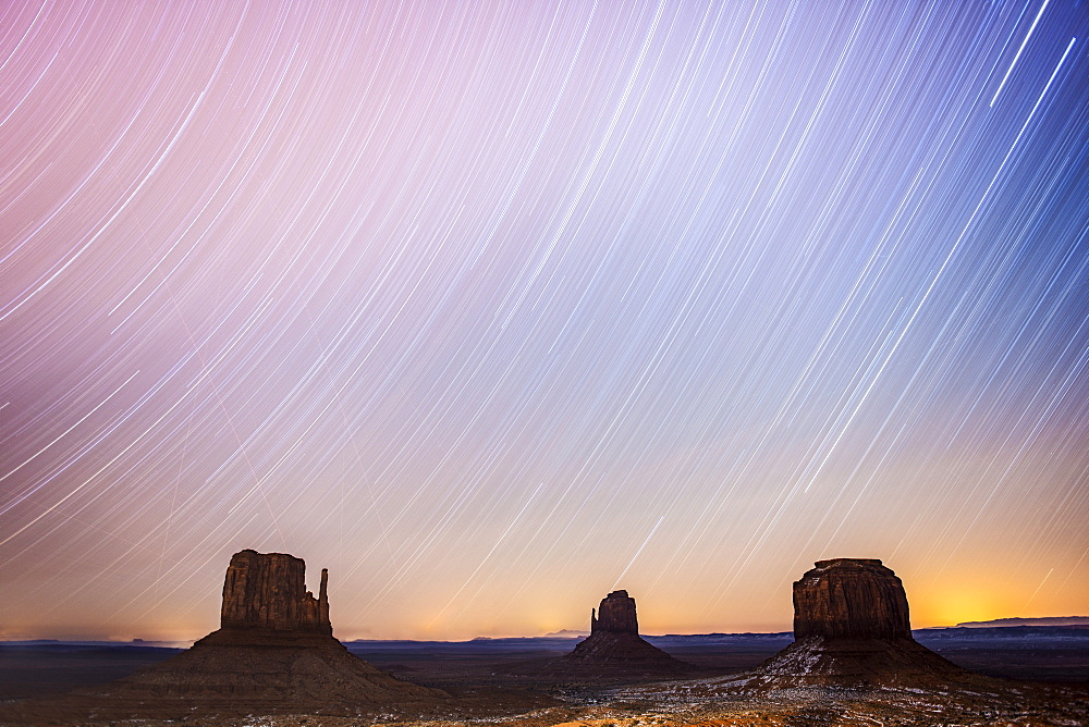 Two-Hour Star Trails Capture With The Mittens At Monument Valley Navajo Tribal Park, Arizona, United States Of America