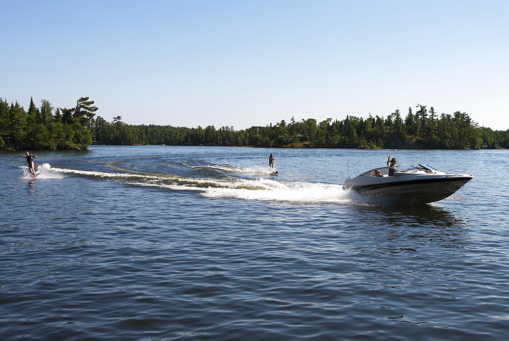 A Boat Pulling Two Waterskiiers, Ontario, Canada