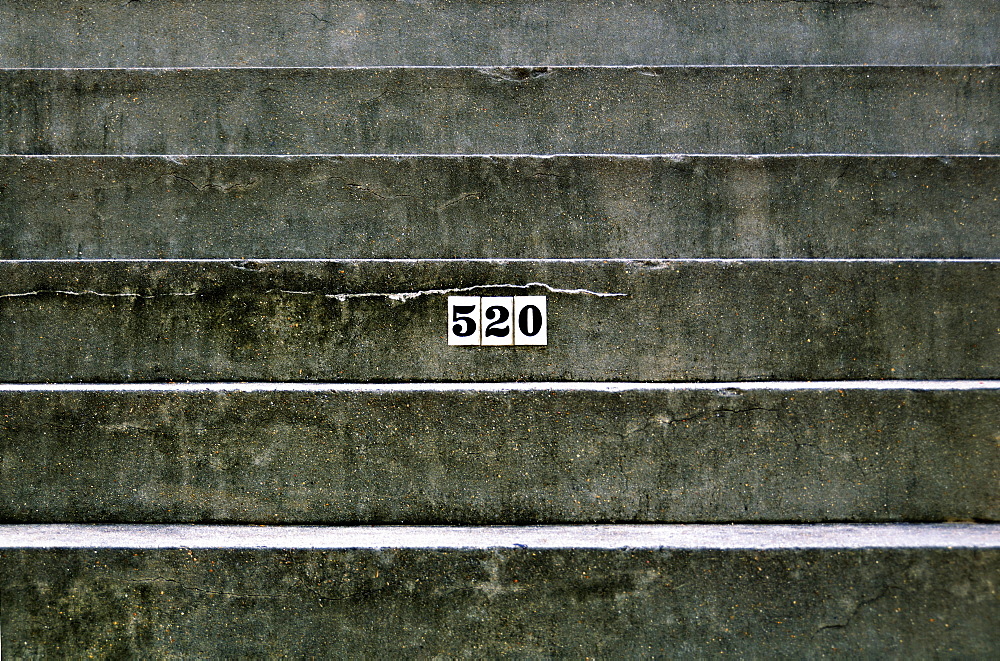 Louisiana, New Orleans, Detail Of An Apartment Address On A Concrete Staircase.