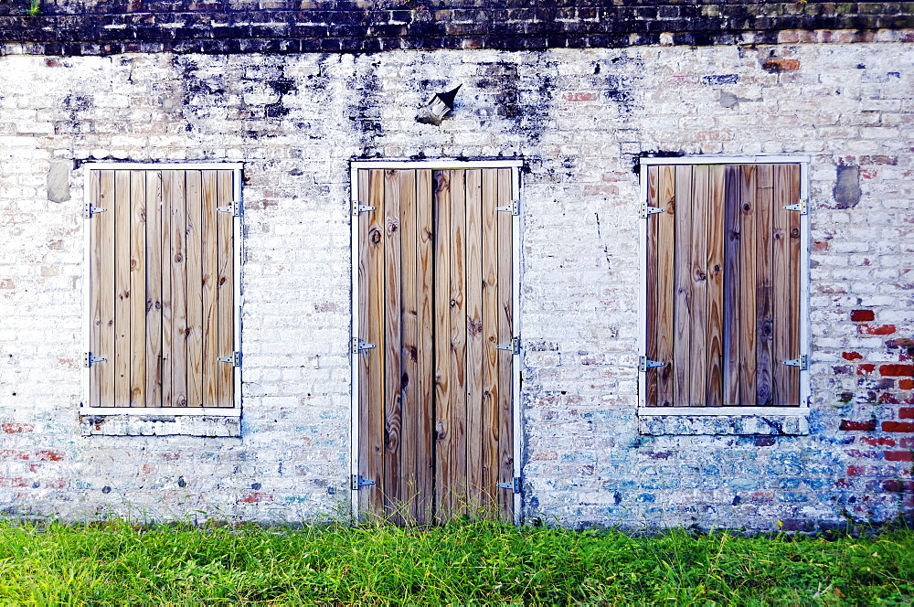 Louisiana, New Oreleans, Abandoned Brick Building With Wooden Doors.