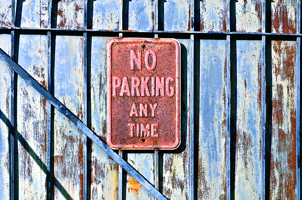 Louisiana, New Orleans, No Parking Sign On Gated Fence.