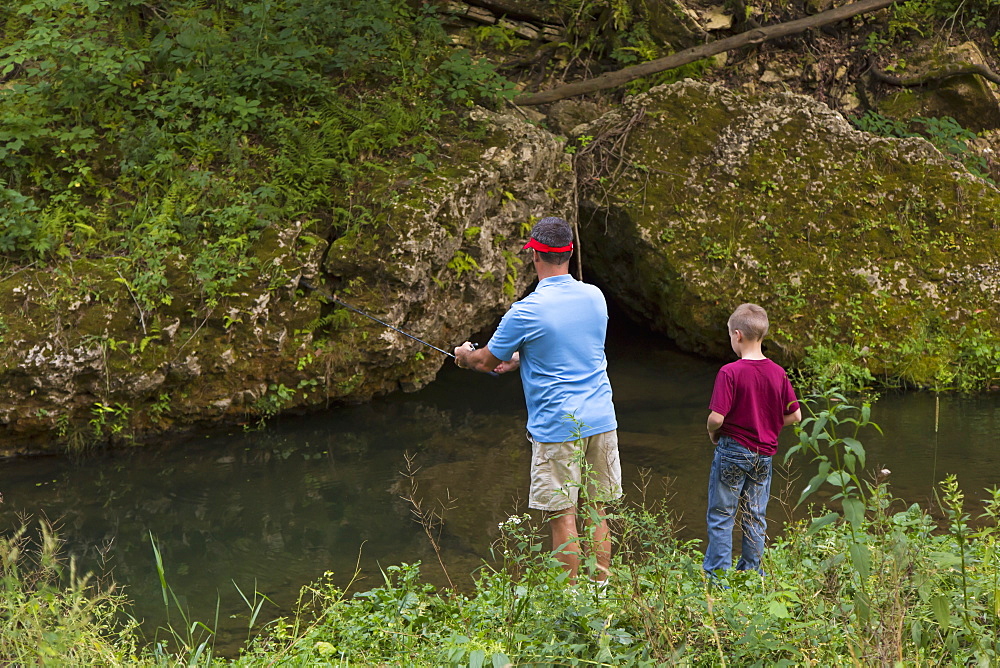 Father And Son Fishing In Bear Creek At Bixby State Preserve, Near Edgewood, Iowa, United States Of America