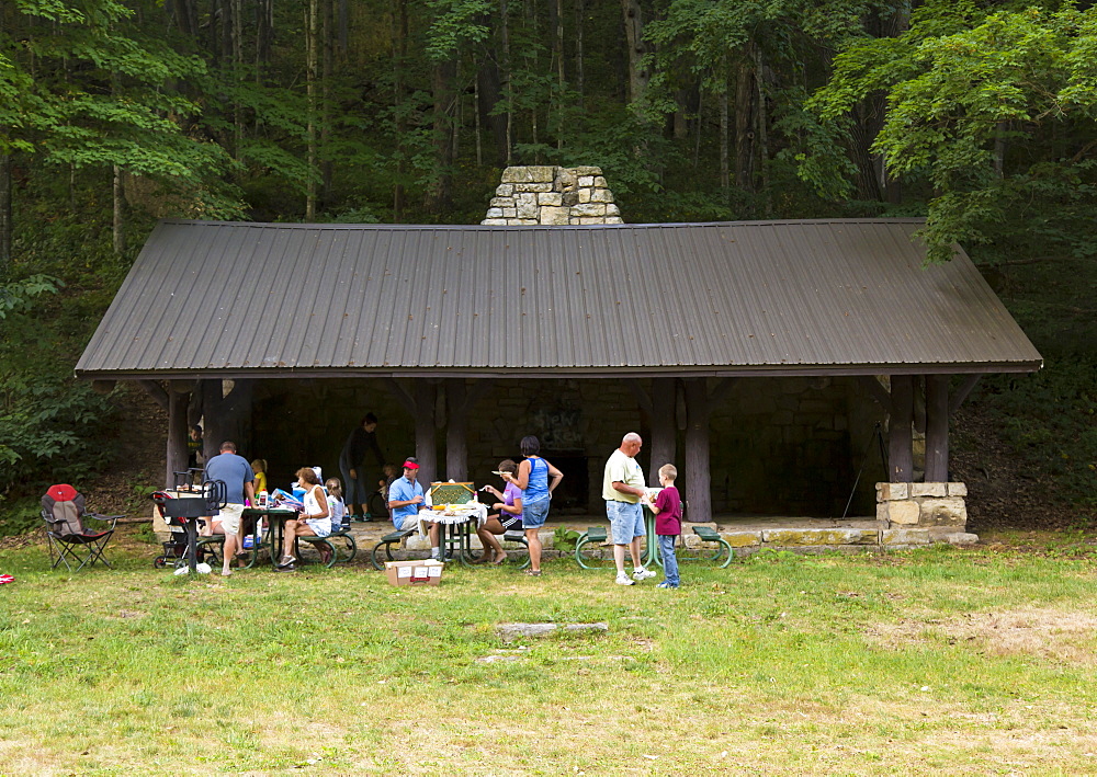 Family Having A Picnic At Bixby State Preserve, Near Edgewood, Iowa, United States Of America