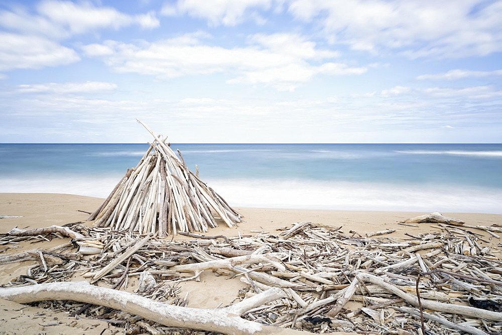 Driftwood Structures Along A Beach, Wailua, Kauai, Hawaii, United States Of America