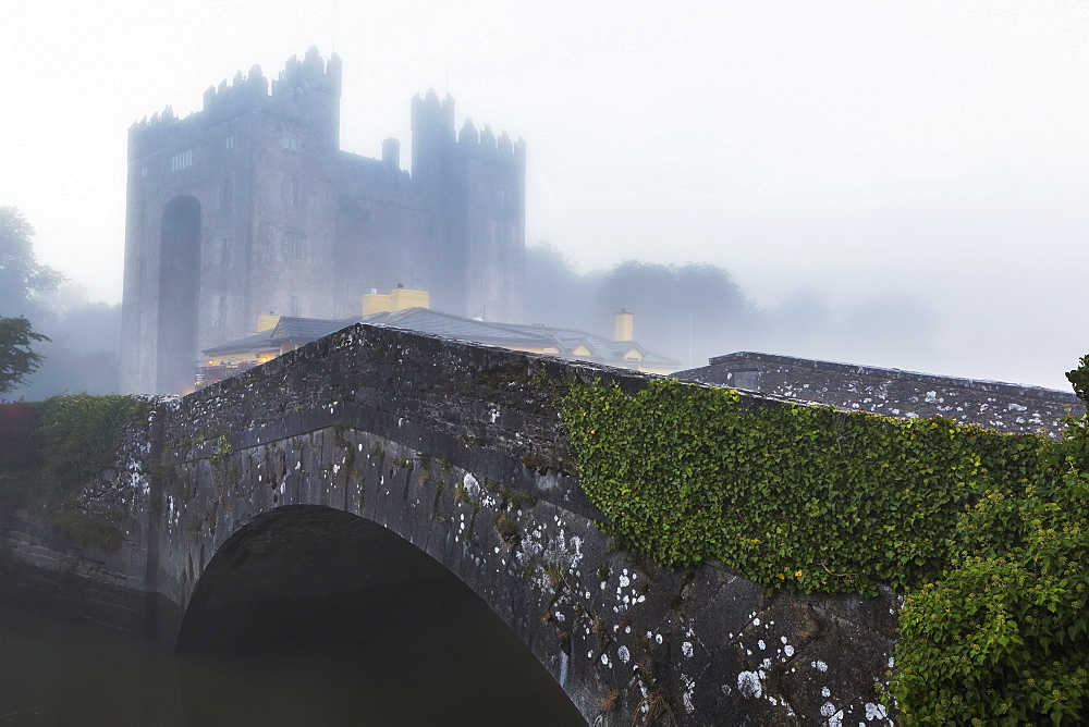 Old Stone Bridge With Castle In The Background And Fog, Bunratty, County Clare, Ireland