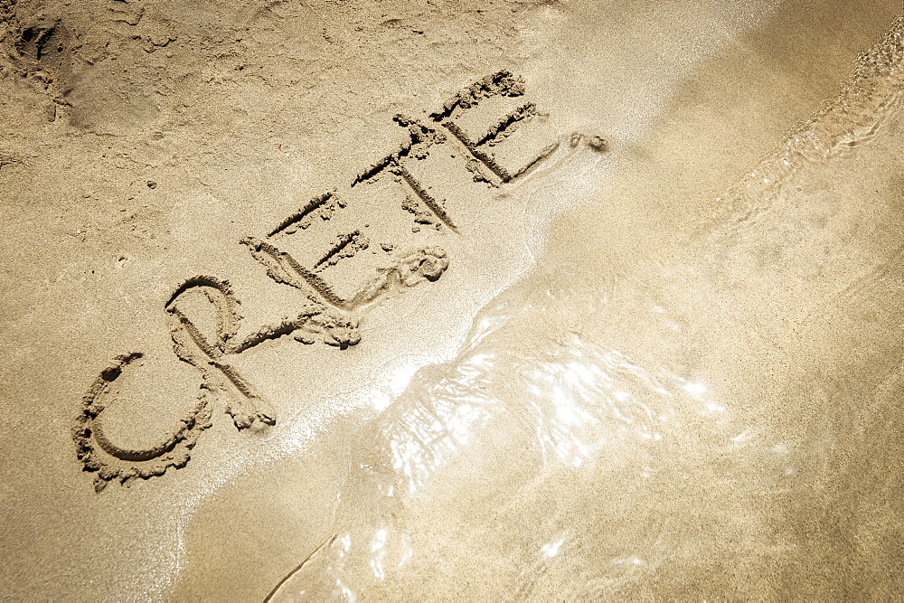 The Word Crete Written In The Sand At The Water's Edge, Elafonisi Beach, Crete, Greece