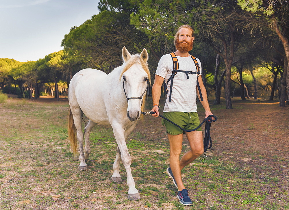 A Man Walking With A White Horse, Cadiz, Andalusia, Spain