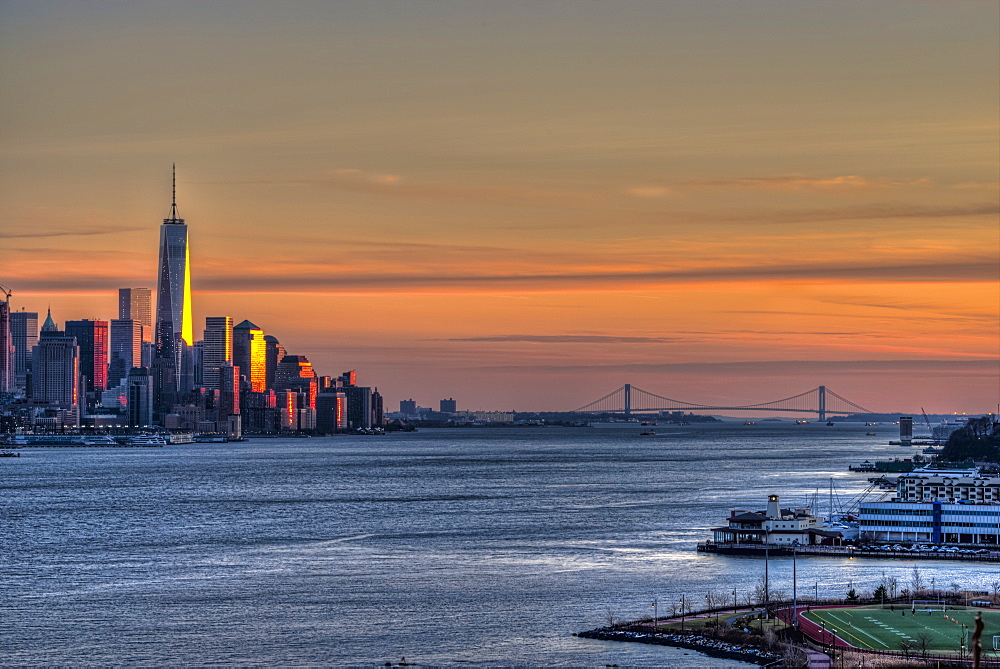 Sunset Over Lower Manhattan And The Verrazano-Narrows Bridge, Weehawken, New Jersey, United States Of America