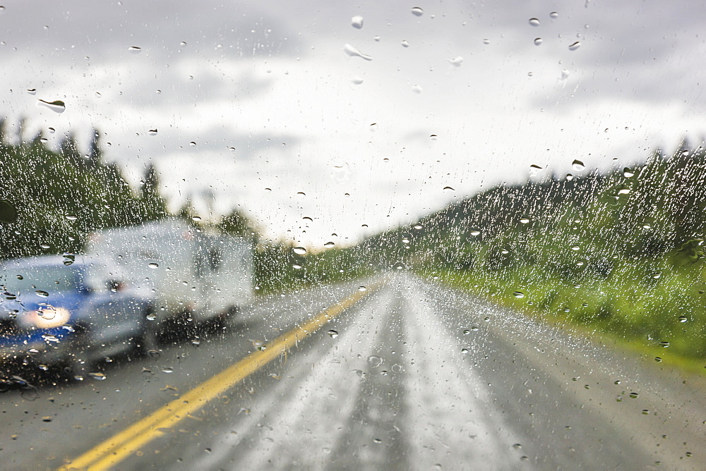 Rain On A Vehicle Window While On The Alaska Highway North Of Watson Lake, Yukon Territory, Canada, Summer