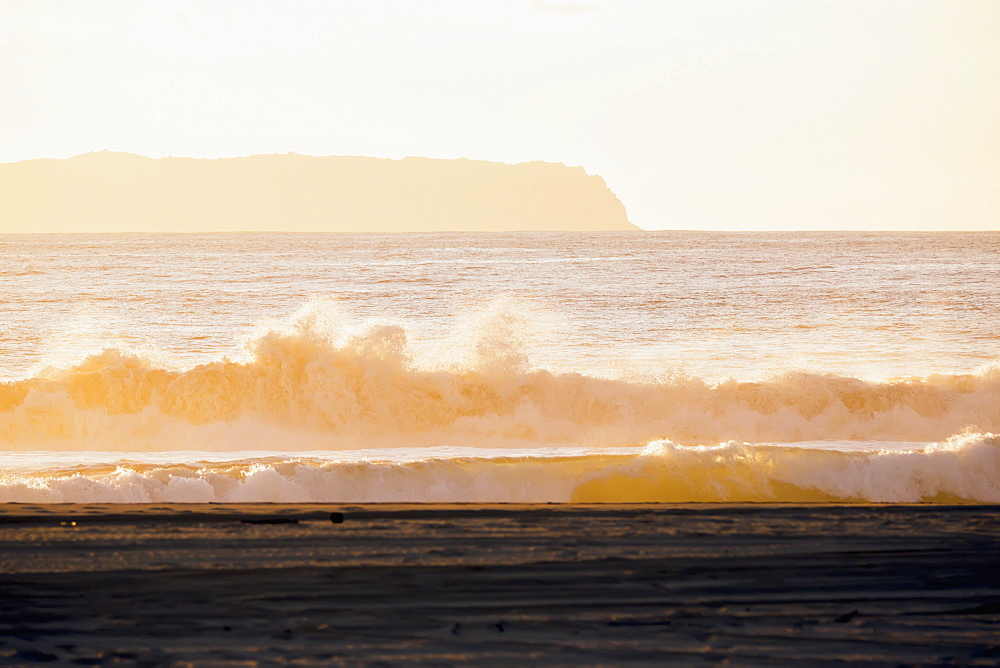 Golden Surf Visible From Barking Sands Beach In Kekaha With Niihau Visible In The Distance, Kekaha, Kauai, Hawaii, United States Of America