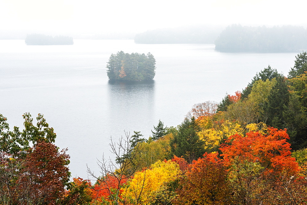 Bright Colours Of Trees In Autumn And Distant Misty Islands In Fairy Lake, Huntsville, Ontario, Canada