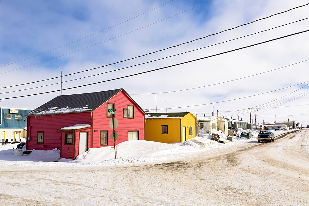 A Street Lined With Pink And Yellow Houses, Barrow, North Slope, Arctic Alaska, USA, Winter