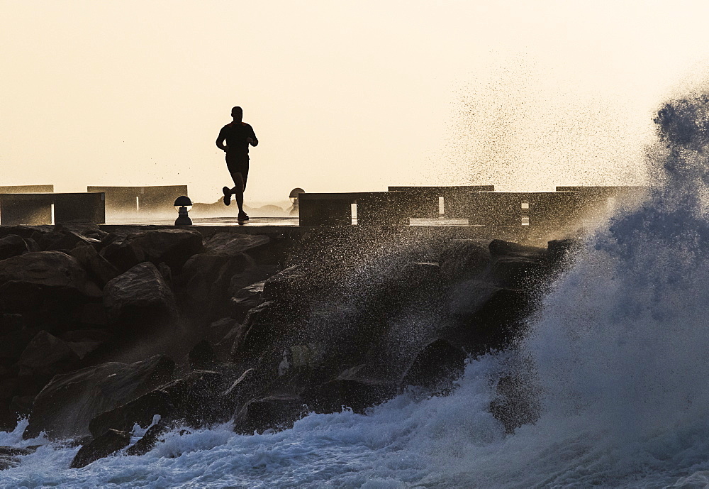 Silhouette Of A Man Running Along The Coast, La Isla, Tarifa, Cadiz, Andalusia, Spain