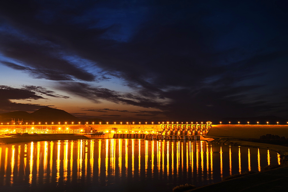 Dam Over The Euphrates River Lit Up At Nighttime, Turkey