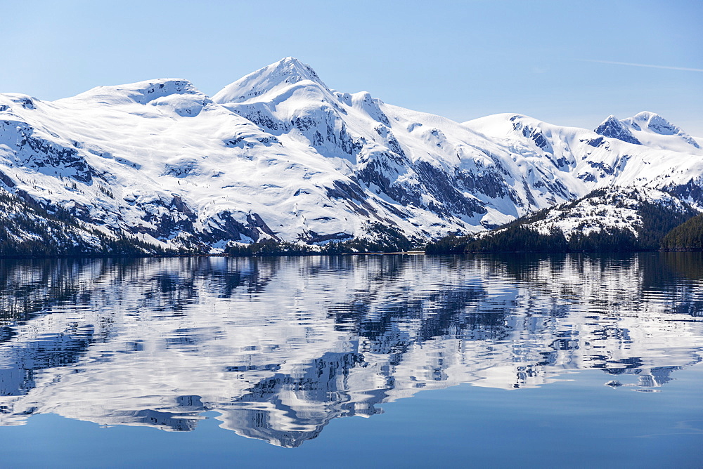 Snow Covered Mountains Reflect In The Calm Waters Of Prince William Sound In Winter, Kings Bay, Alaska, United States Of America