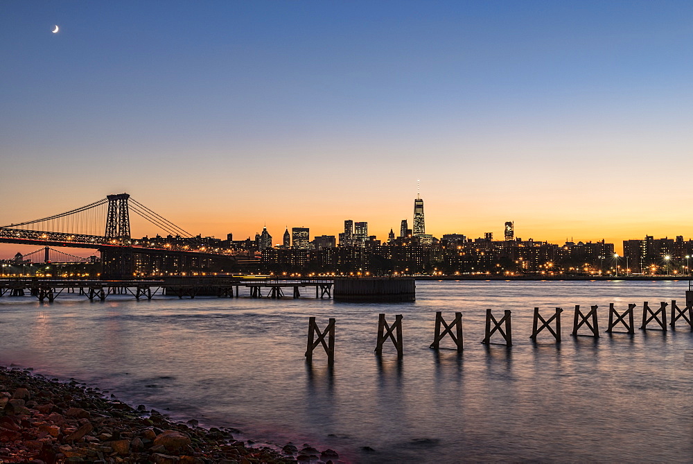 Sunset Over Lower Manhattan Near World Trade Center And Williamsberg Bridge, Brooklyn, New York, United States Of America