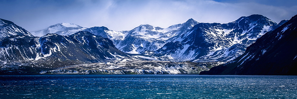 Snowy Mountains In Sunshine Beside Blue Sea, Antarctica