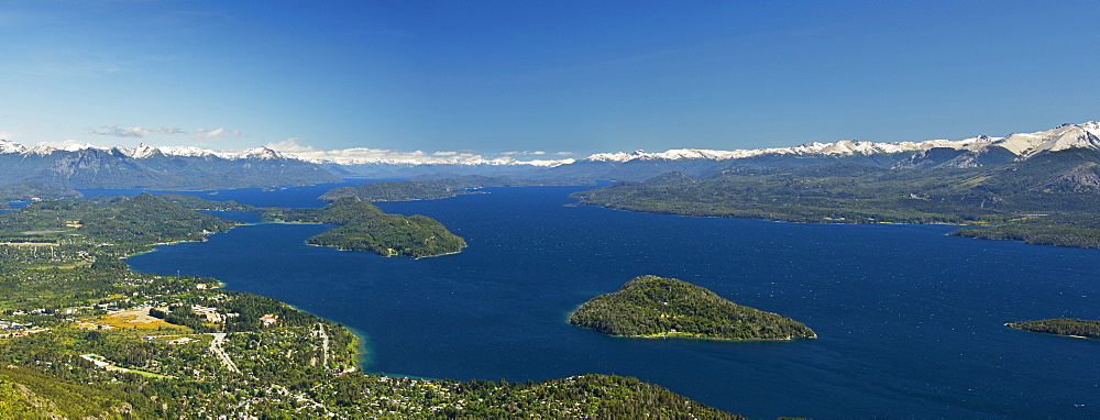 Panoramic View Of A Large Lake In Patagonia, With Snow-Capped Mountains And Blue Sky, Argentina
