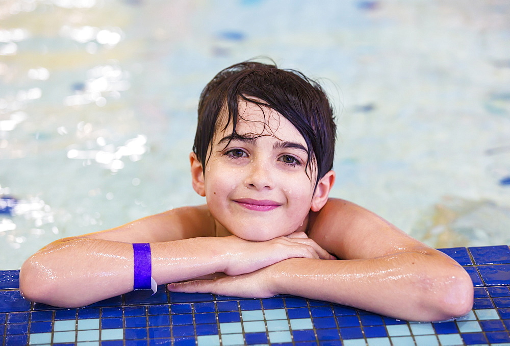 Young Boy In An Indoor Swimming Pool, Spruce Grove, Alberta, Canada