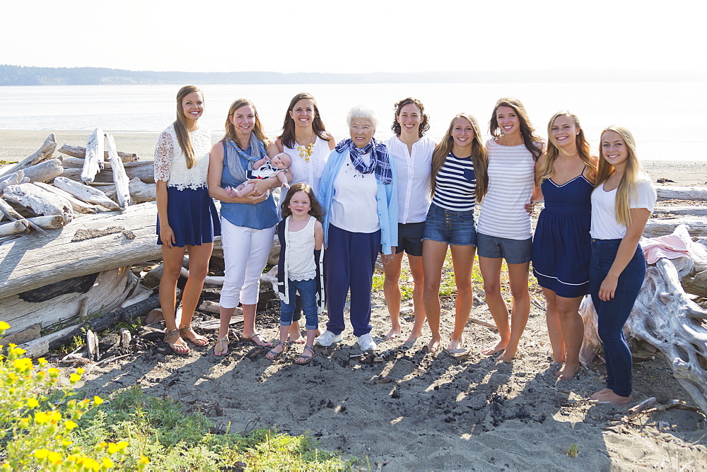 Three Generations Of Women In A Family Posing On A Beach, A Grandmother And Eight Granddaughters, Fox Spit, Whidbey Island, Washington, United States Of America