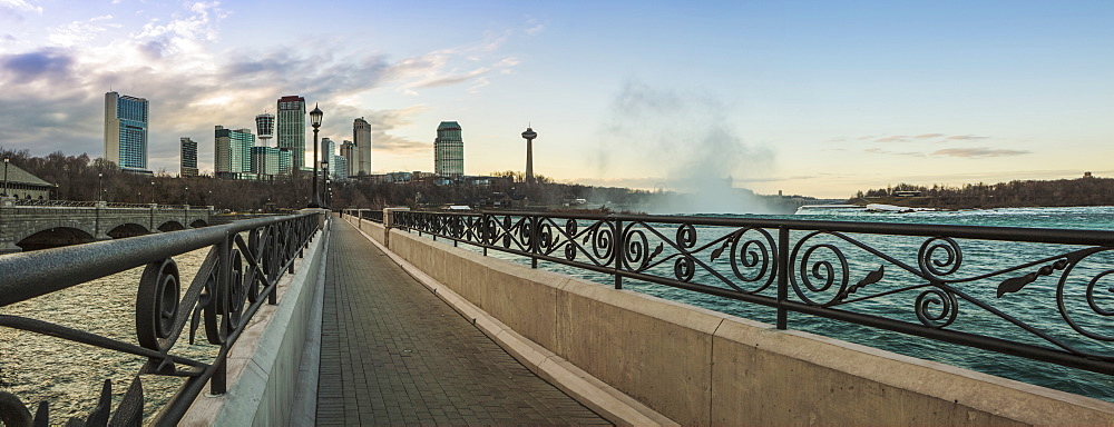 A Walkway With A City Skyline In The Background, Niagara Falls, Ontario, Canada