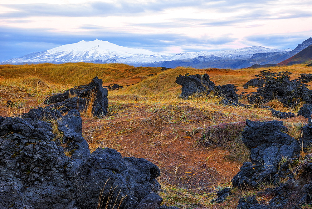 Snaefellsjokull Rises Above The Surrounding Landscape On Iceland's Snaefellsness Peninsula, With The Sunrise Lighting Up The Sky, Iceland