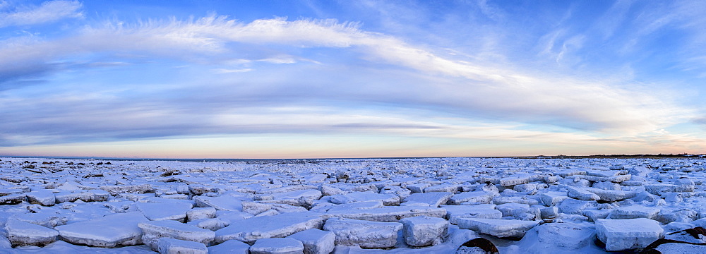 Ice Forms On The Shores Of Hudson Bay As Sunset Starts To Light Up The Clouds, Churchill, Manitoba, Canada